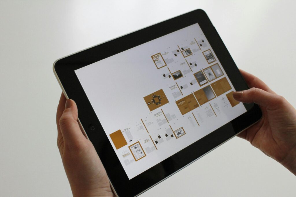 hand holding black ipad